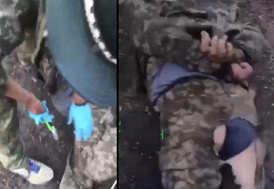 Russian troops caught castrating 'prisoner' Ukrainian soldier with box-cutter in 'sick' viral video