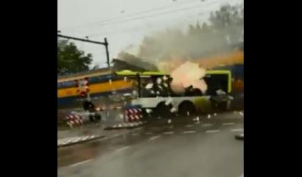 Netherlands: Passenger train crashes into bus at level crossing; video