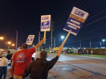 Over 13,000 workers at three US auto plants strike work that could hit US economy